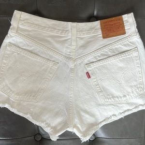 Levi’s distressed white jean shorts